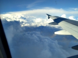 [picture: Clouds, blue sky, shadows, wing]