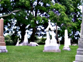 [picture: Gravestones under the tree]