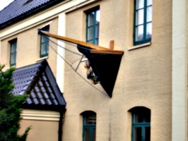 [picture: Ship's figurehead on a building]