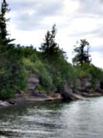 [picture: Beach with overgrown cliffs]