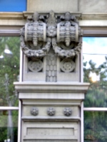 [picture: Carved laurel wreath corbels]