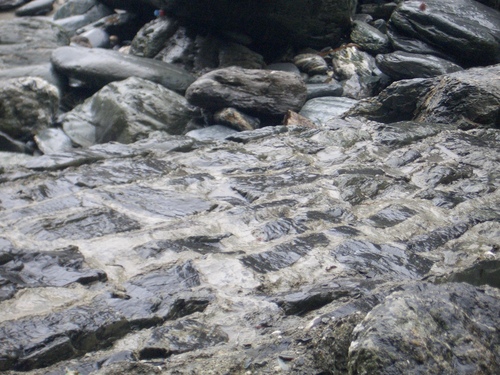 [Picture: Ruins of Tintagel Castle 13: Tide-washed bricks]