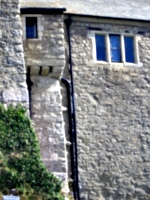 [picture: Castle wall with overhang]