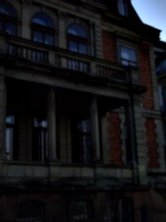 [picture: Creepy old building with stone balcony 2]