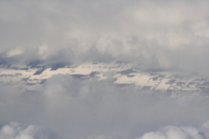 [picture: Snow-covered fields seen through clouds 2]