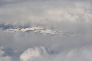 [picture: Snow-covered fields seen through clouds 4]