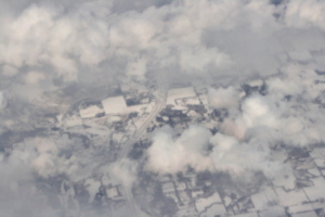 [picture: Snow-covered fields seen through clouds 6]