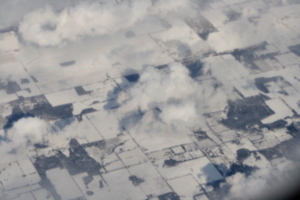 [picture: Snow-covered fields seen through clouds 7]