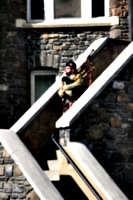 [picture: Lone bagpiper on the castle walls.]