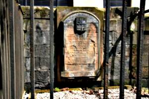 [picture: Weathered tombstone]