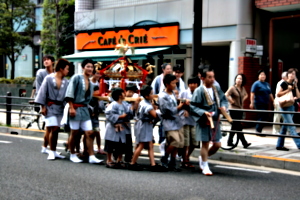 [picture: Children carrying the mikoshi]