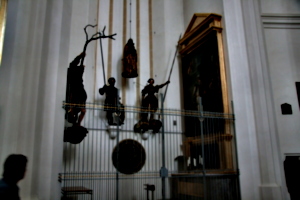 [picture: Side-chapel with dangling figures]