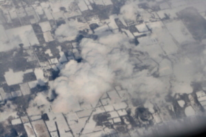 [picture: Snow-covered fields seen through clouds 8]